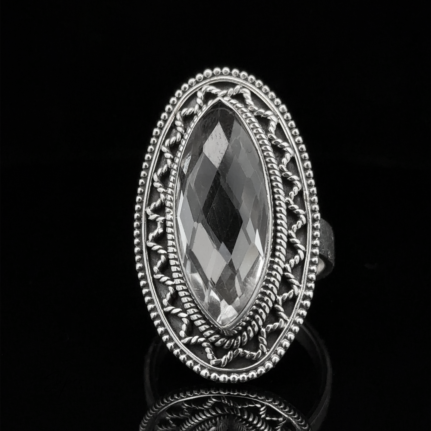 
                  
                    Marquise Shaped Gemstone Ring With Vintage Shield Border in an ornate Sterling Silver setting on a black background, giving it a Bohemian twist.
                  
                