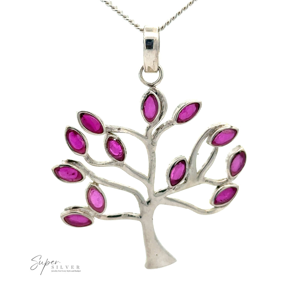 
                  
                    A Tree of Life Pendant with Stone Leaves hangs elegantly on a chain.
                  
                