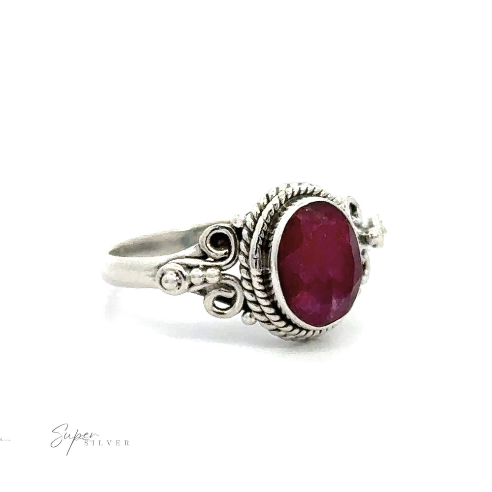 
                  
                    Natural Oval Gemstone Ring with Intricate Rope and Long Spiral Border with a vintage appeal in its ornate design.
                  
                