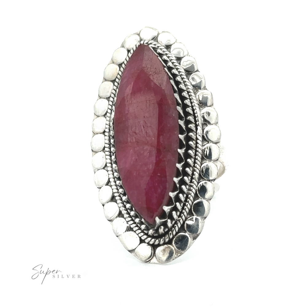 
                  
                    An oval-shaped ring with a large, maroon gemstone set in a detailed silver band surrounded by smaller decorative silver elements. The band is inscribed with "Super Silver," making the Statement Marquise Shaped Gemstone Ring the perfect piece for those who appreciate bohemian jewelry.
                  
                
