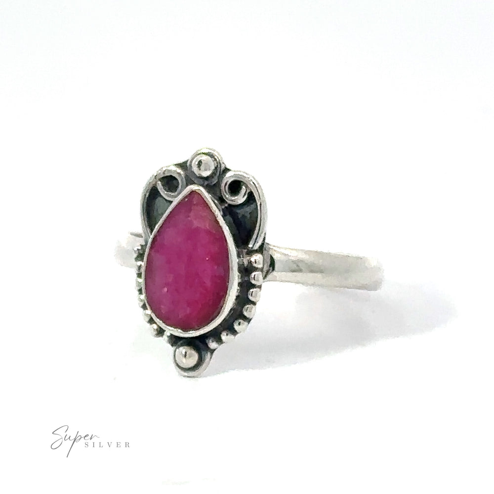 
                  
                    Vintage Inspired Teardrop Gemstone Ring featuring a pear-shaped pink stone set in an ornate bezel, displayed against a white background. This .925 Sterling Silver piece adds a boho vibe to any look.
                  
                