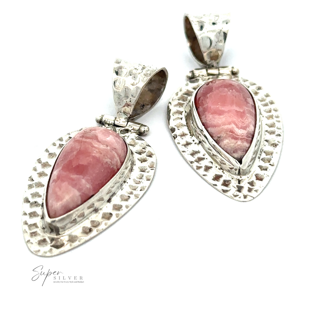
                  
                    A Rhodochrosite Hammered Teardrop Pendant is displayed on a white background. The stones, known for their emotional healing properties, feature subtle variations in shades of pink. "Super Silver" brand is noted at the bottom, emphasizing their unique design.
                  
                