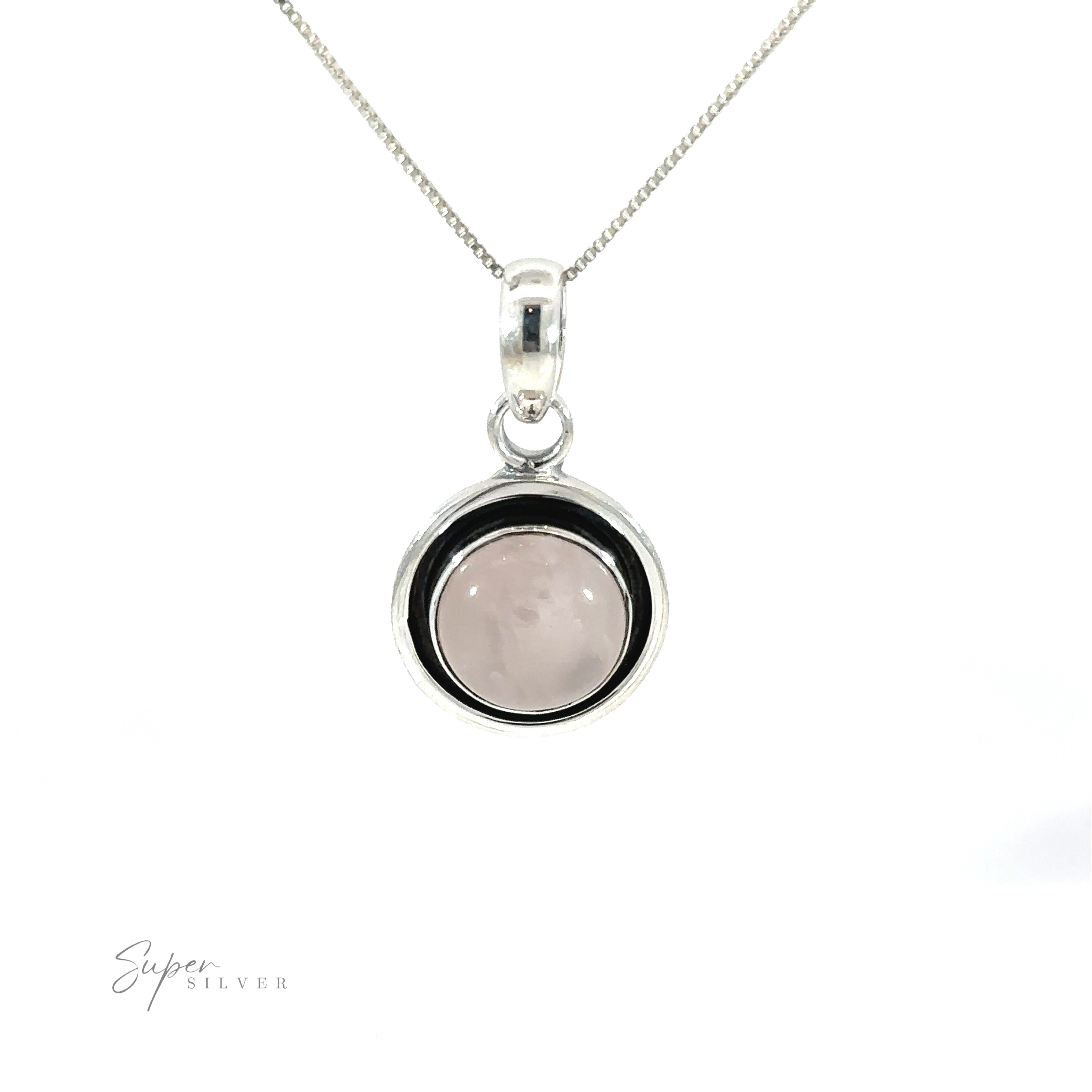 A Minimalist Round Gemstone pendant with an oxidized edge.