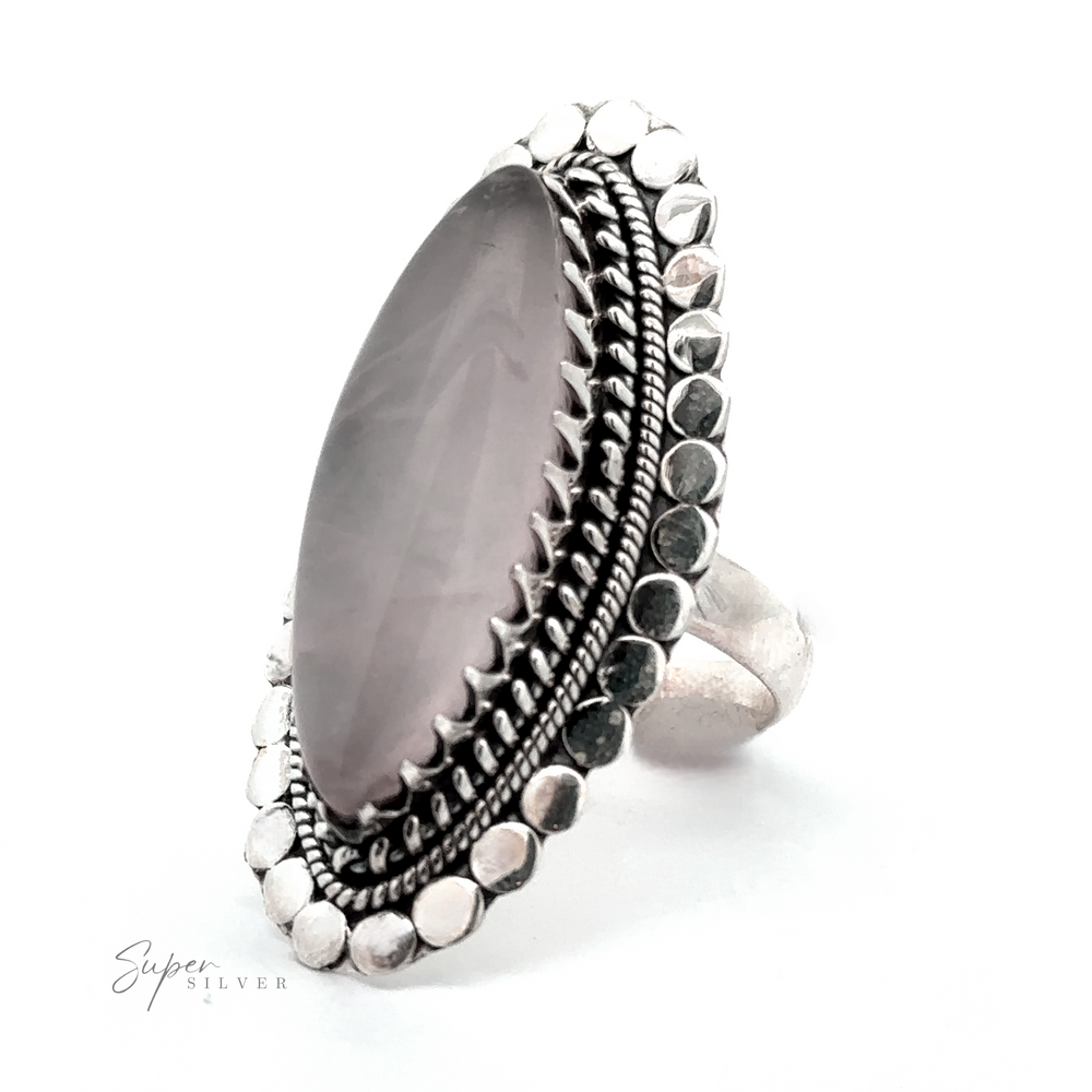 
                  
                    A Statement Marquise Shaped Gemstone Ring with intricate metalwork around the band is pictured against a white background, exuding a touch of Bohemian Jewelry charm. The logo "Super Silver" is visible in the bottom left corner.
                  
                