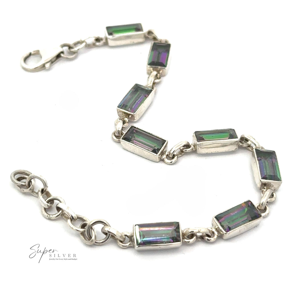 
                  
                    This Rectangle Rainbow Mystic Topaz Bracelet, adorned with rectangular iridescent mystic topaz gemstones, features a secure clasp and is elegantly displayed against a white background.
                  
                