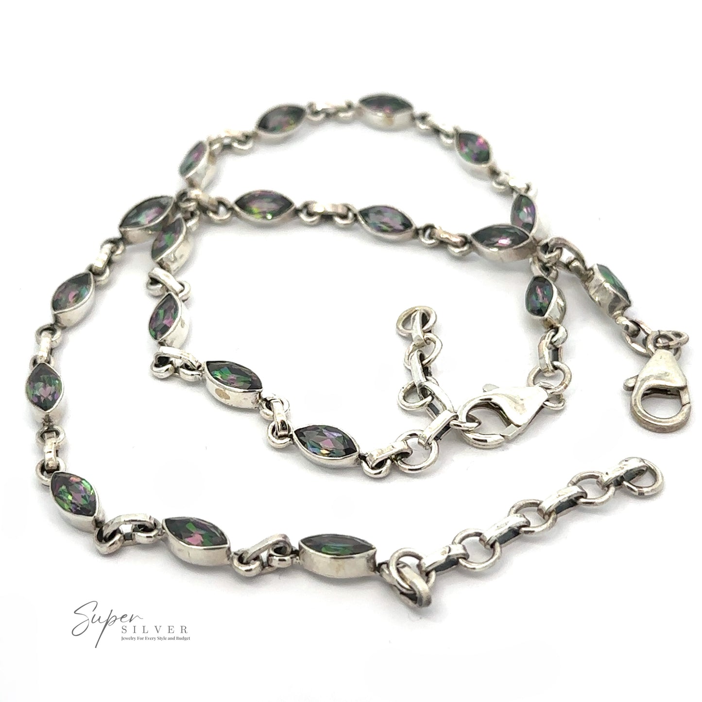 
                  
                    A sterling silver chain bracelet with marquise-shaped, multicolored gemstones and a lobster clasp. The Rainbow Mystic Topaz Marquise Link Bracelet features enhancing links between the stones. The branding 'Super Silver' is visible in the corner.
                  
                