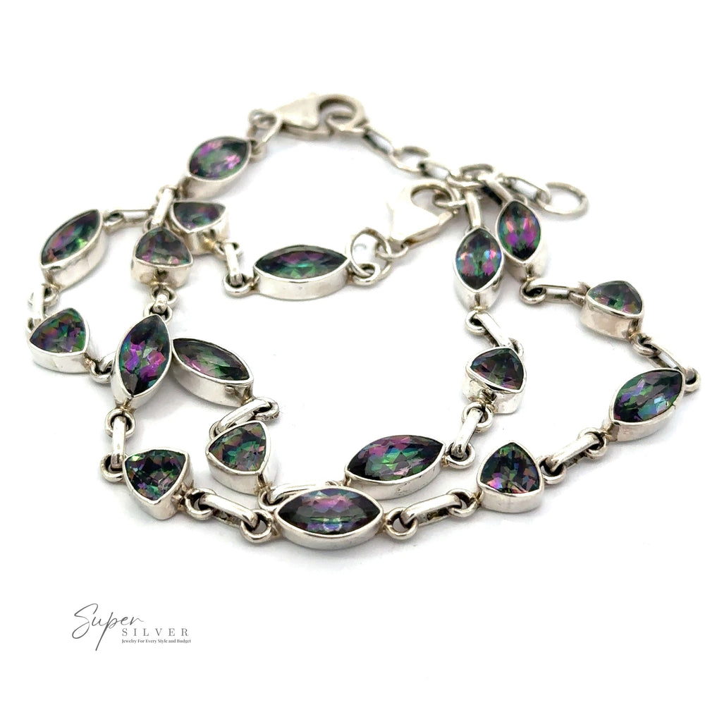 A Rainbow Mystic Topaz Marquise and Triangle Shape Link Bracelet featuring marquise-shaped mystic topaz gemstones with green and purple hues, laid out on a white background. The bracelet has a lobster clasp closure, showcasing the 