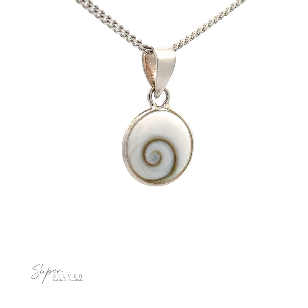 
                  
                    A silver chain necklace showcases a Small Round Shiva Shell Pendant featuring a circular white stone with a spiral pattern, adding coastal elegance to any outfit. The piece is crafted from .925 Sterling Silver for lasting beauty and quality.
                  
                