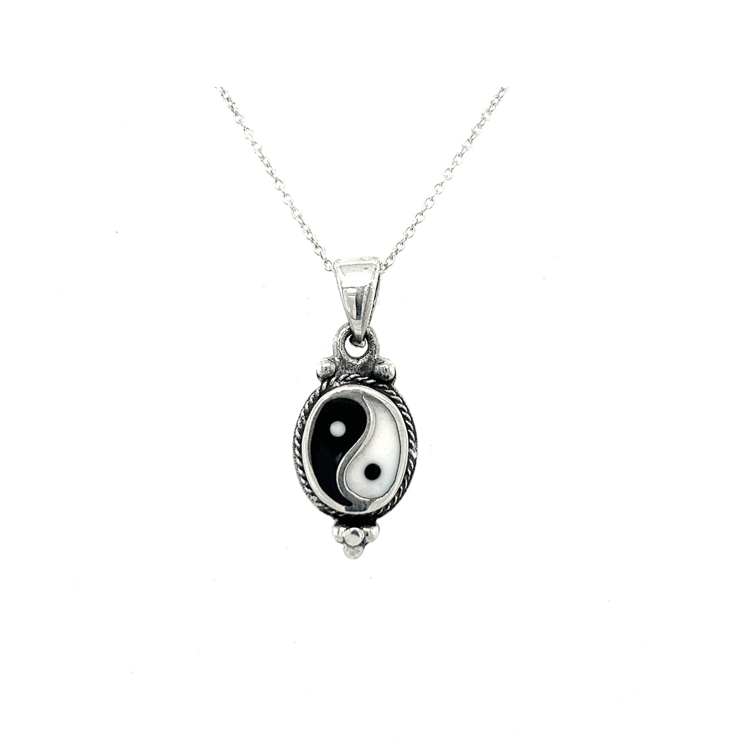 
                  
                    An interconnectedness symbol in the form of a black and white Various Yin-Yang Pendant hangs delicately on a sleek silver chain.
                  
                