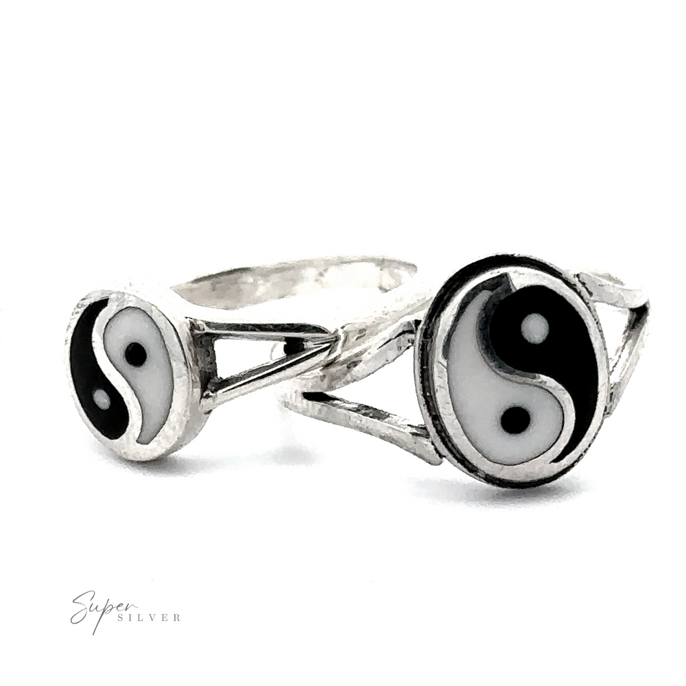 Two Simple Inlaid Yin-Yang Rings crafted from Sterling Silver, displaying yin-yang symbols on white backgrounds. The rings feature contrasting black and white halves with alternating dots, symbolizing balance.