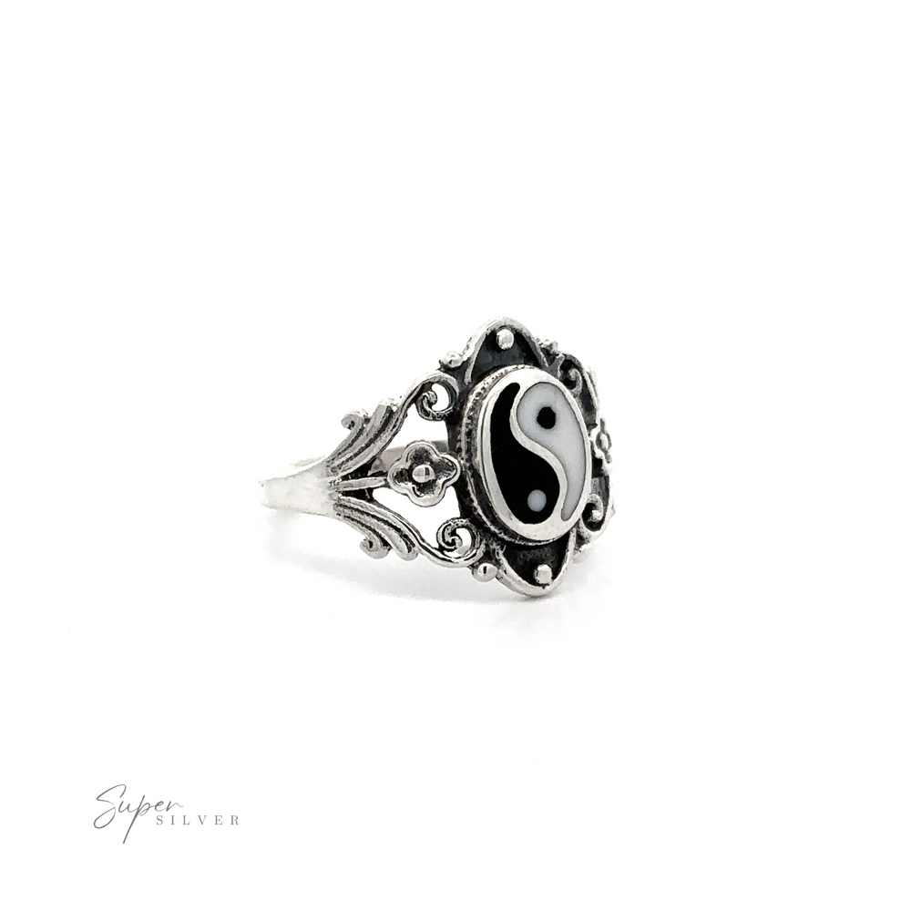 
                  
                    A Floral Filigree Inlay Stone Ring featuring a turquoise yin yang symbol on a white background.
                  
                