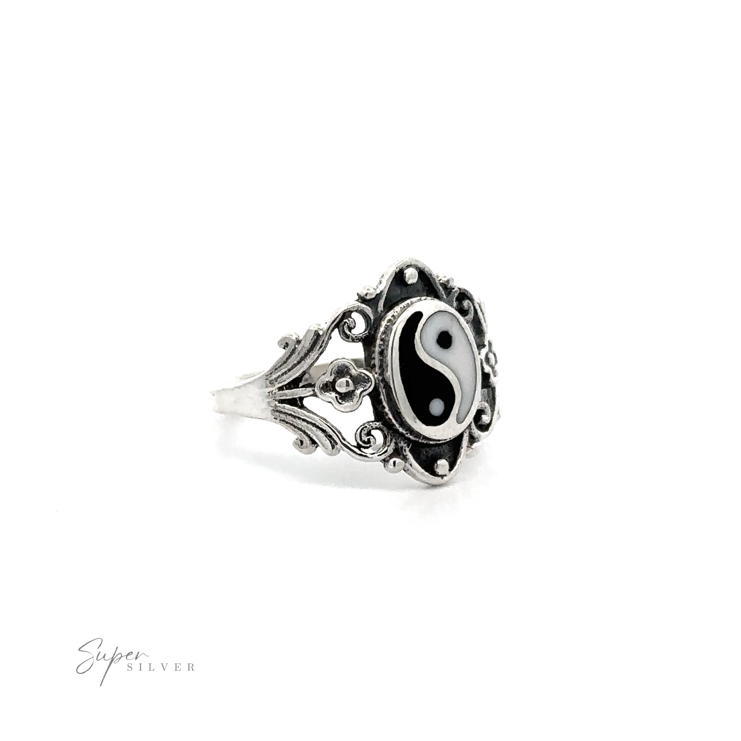 A Floral Filigree Inlay Stone Ring featuring a turquoise yin yang symbol on a white background.