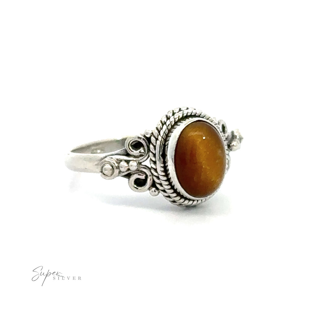 
                  
                    Amber gemstone set in a Natural Oval Gemstone Ring with Intricate Rope and Long Spiral Border vintage boho ring.
                  
                