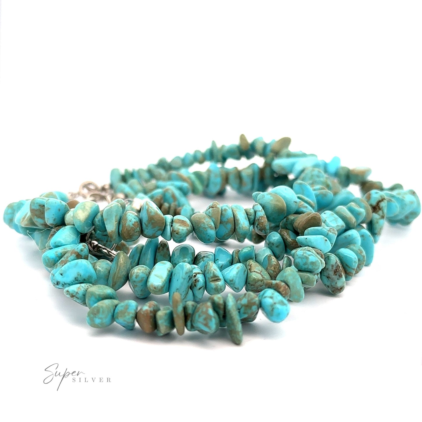 
                  
                    A Southwest Colorado Turquoise Chip Bracelet or Anklet is displayed against a white background. The beads, made of Colorado turquoise, are irregularly shaped and vary in shades of blue and green. A "Super Silver" logo is visible in the lower left corner, adding a touch of southwest charm to the piece.
                  
                