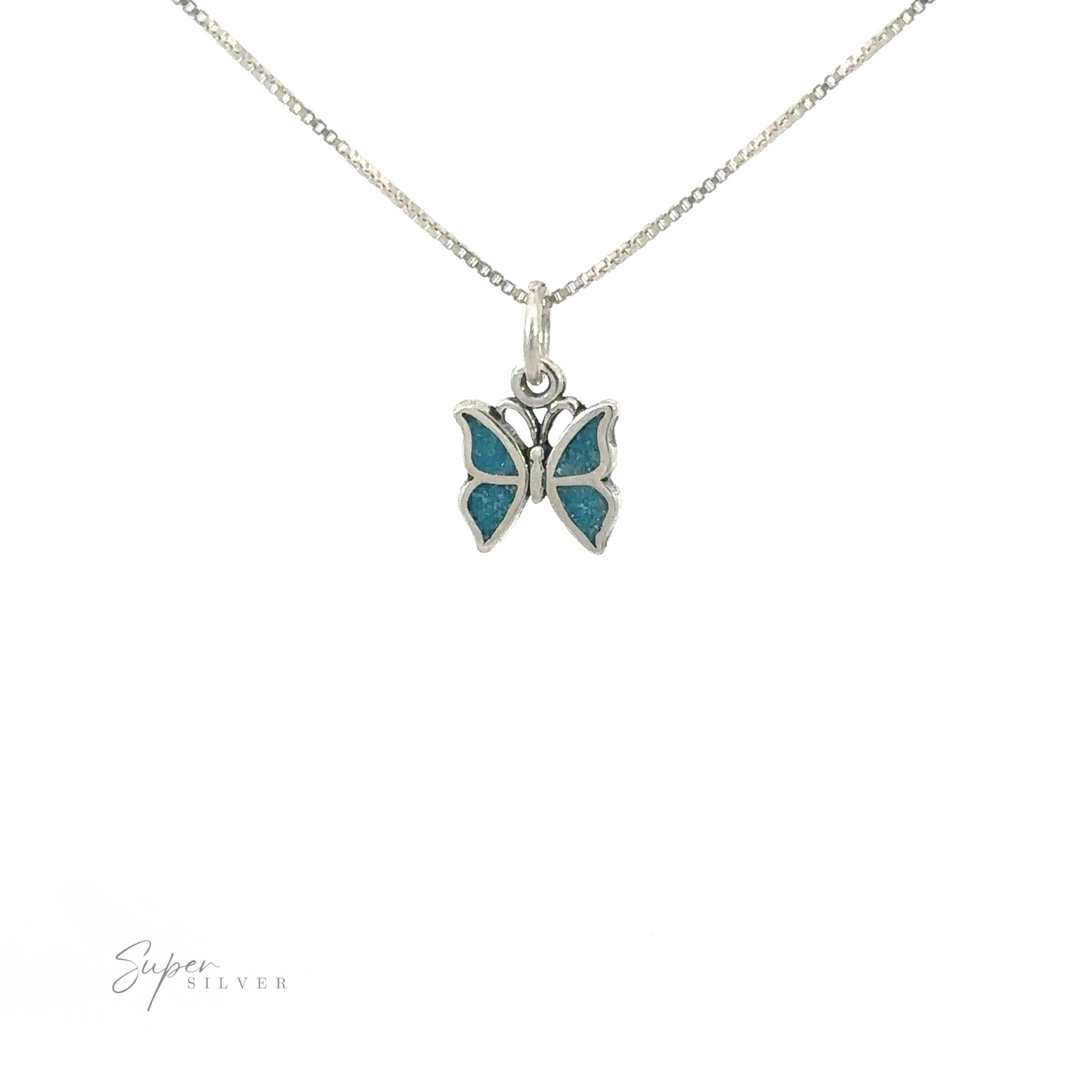 A Little Turquoise Butterfly Pendant with turquoise brilliance on a silver chain, showcasing understated beauty.