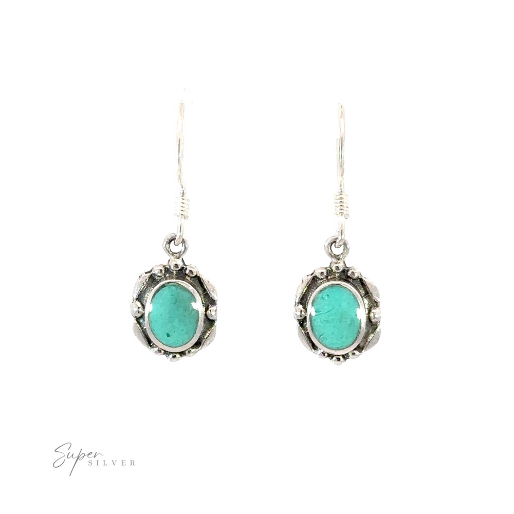 
                  
                    Oval Inlaid Stone Earrings with sterling silver and turquoise stones.
                  
                