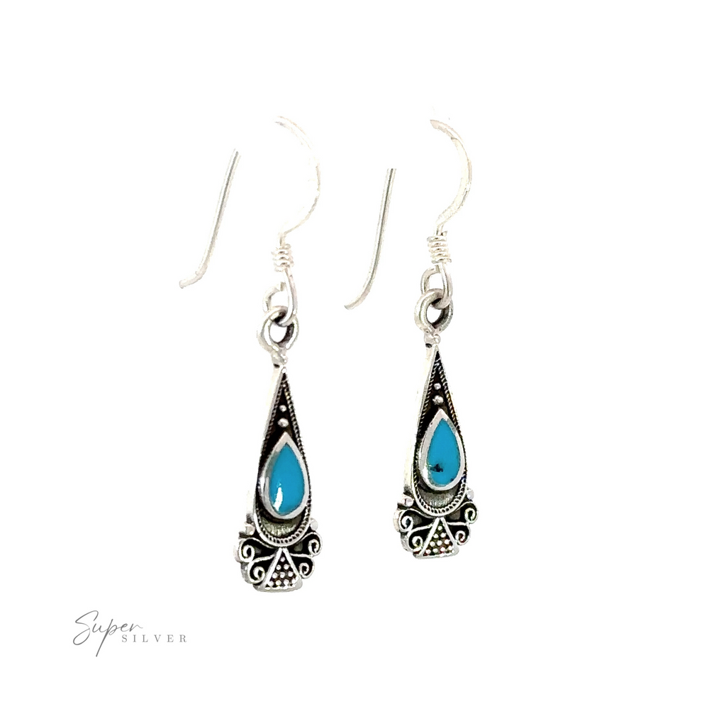 
                  
                    A pair of Bali Inspired Teardrop Shaped Earrings with Inlay Stones.
                  
                