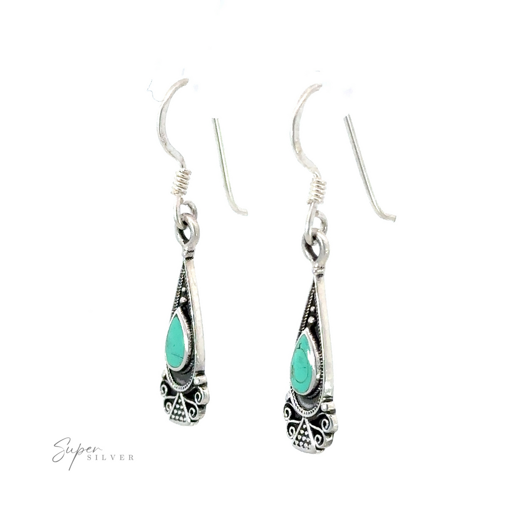 
                  
                    A pair of Bali Inspired Teardrop Shaped Earrings With Inlay Stones, crafted in Bali.
                  
                