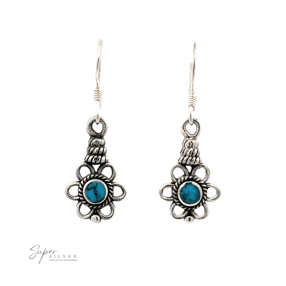 
                  
                    Flower Design Earrings With a Round Stone with intricate floral designs and six different stones, including a round turquoise center stone. Displayed on a white background, "Super Silver" branding is visible in the lower left corner.
                  
                