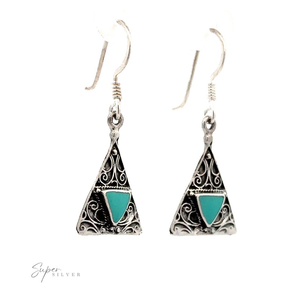 
                  
                    A pair of Freestyle Design Triangle Shape Inlaid Earrings with intricate filigree design and coral stones, attached to fishhook ear wires, offering a unique freestyle design.
                  
                