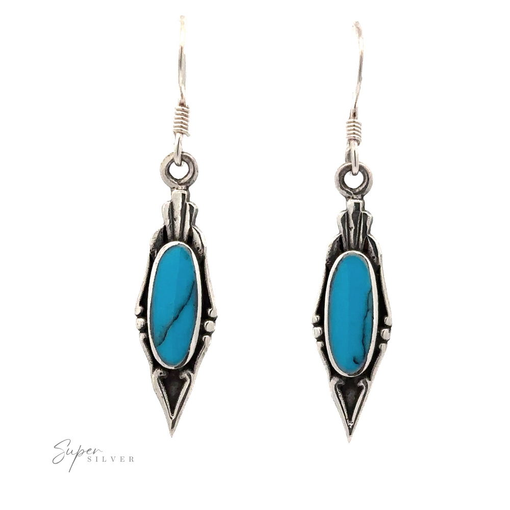 
                  
                    A pair of Elegant Inlaid Earrings with Oval Stone. The vintage design features intricate detailing around the stones.
                  
                