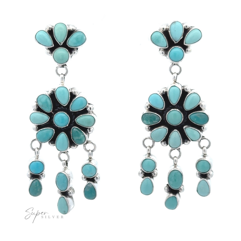
                  
                    A pair of Native American Turquoise Flower Earrings, featuring Native American craftsmanship with flower-like designs, oval stones, and drop elements.
                  
                