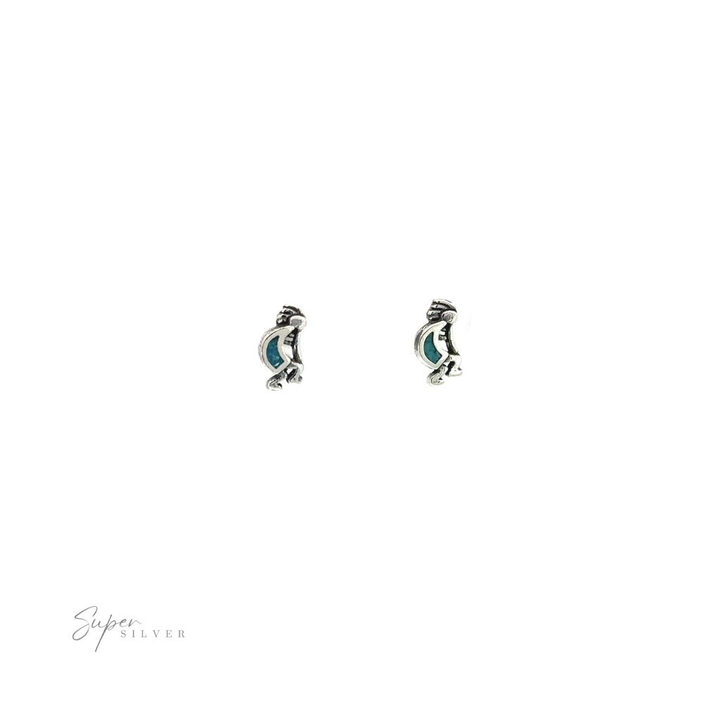 
                  
                    A pair of Turquoise Kokopelli Studs with reconstituted turquoise stones.
                  
                
