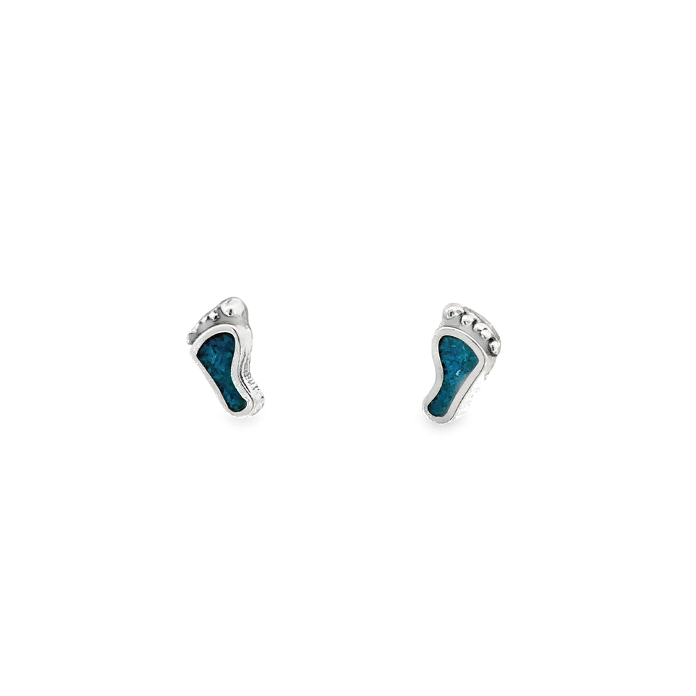 A pair of Turquoise Feet Studs featuring inlaid turquoise on .925 Sterling Silver.