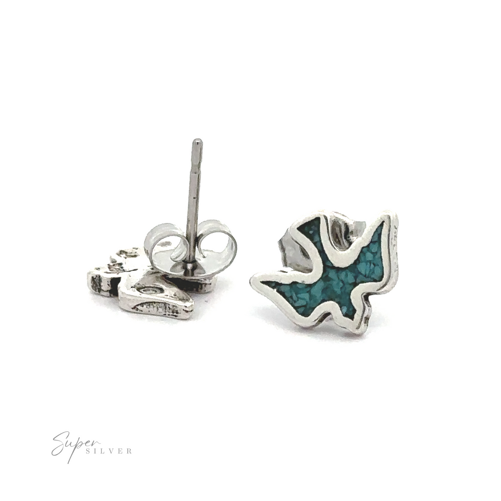 A pair of Dove Studs with Inlaid Turquoise earrings. The studs feature a vibrant turquoise hue.