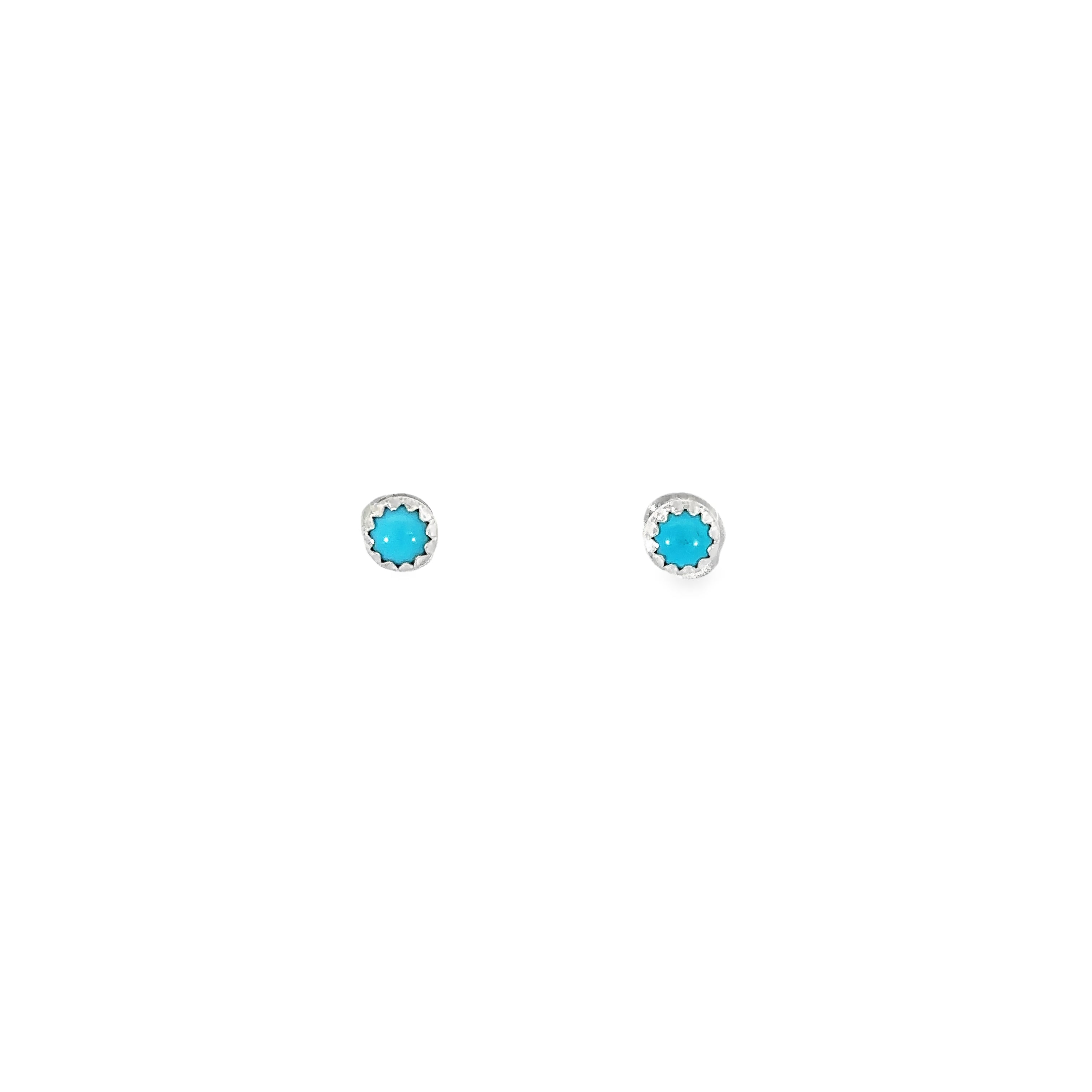 A pair of Circular Turquoise Studs on a white background.