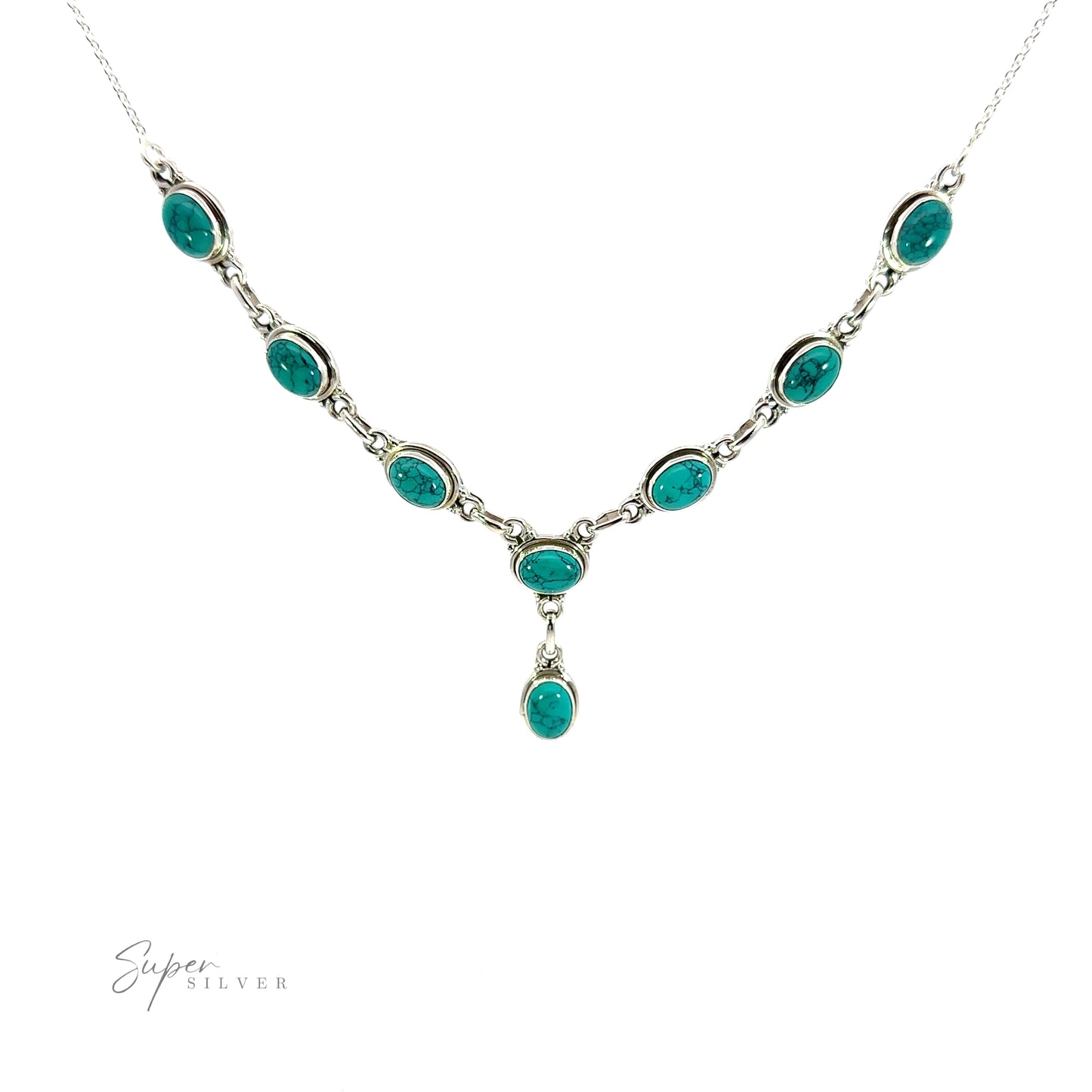 
                  
                    A Simple Oval Y Necklace with Gemstones featuring multiple green oval gemstones arranged in a symmetrical pattern, with one hanging stone in the center. The words "Super Silver" are present in the bottom left corner, adding a touch of bohemian charm.
                  
                
