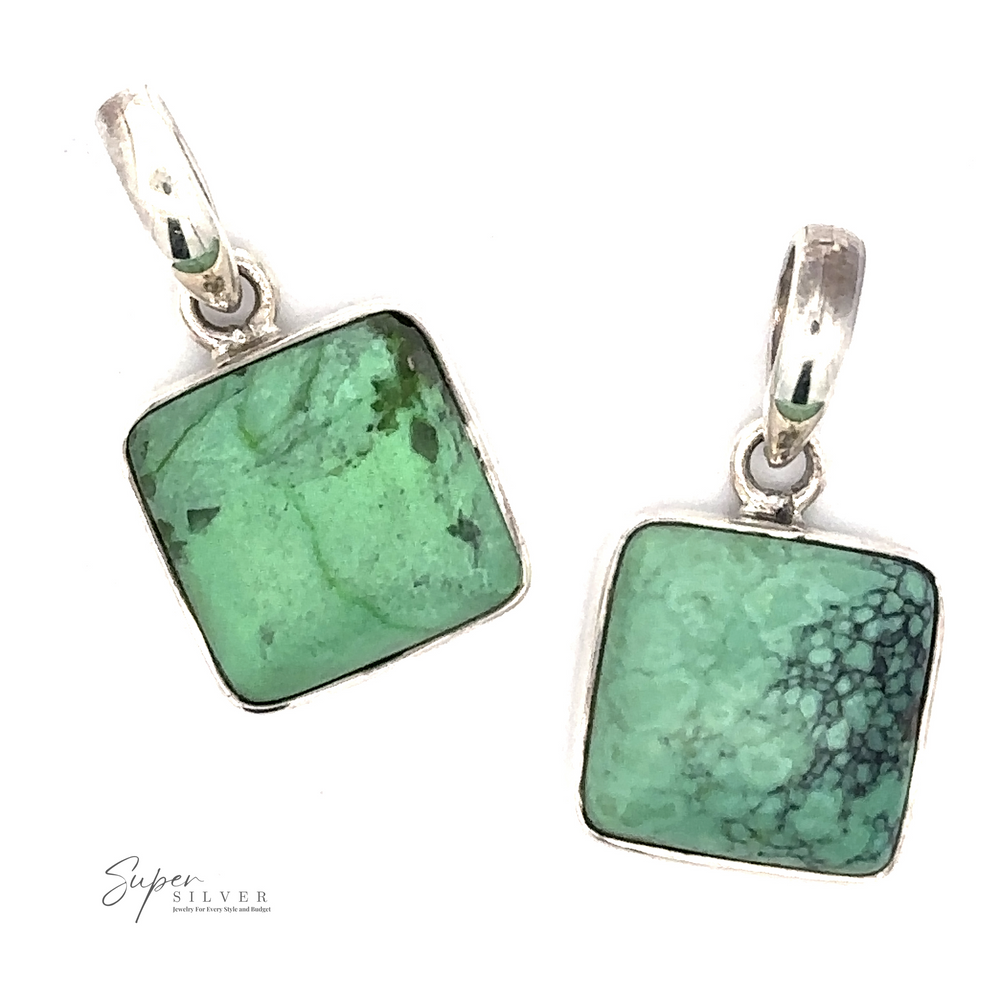 
                  
                    Two Natural Turquoise Square Pendants with .925 Sterling Silver settings, featuring natural turquoise stone in varying shades with slight black veining, each with a silver loop for attaching to a chain.
                  
                