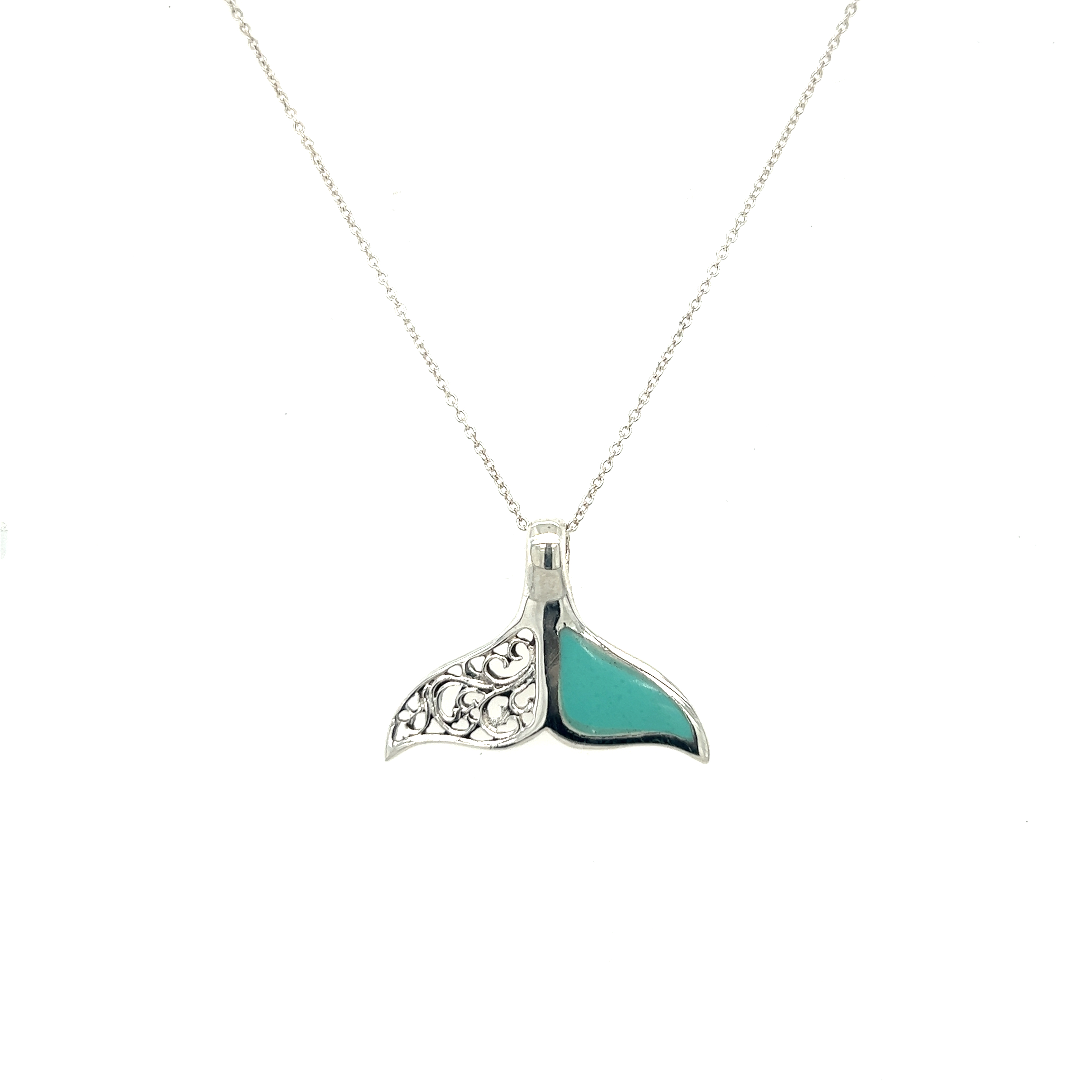 A Half Filigree Whale Tail Pendant with turquoise inlay, representing ocean conservation and supporting Oceana.