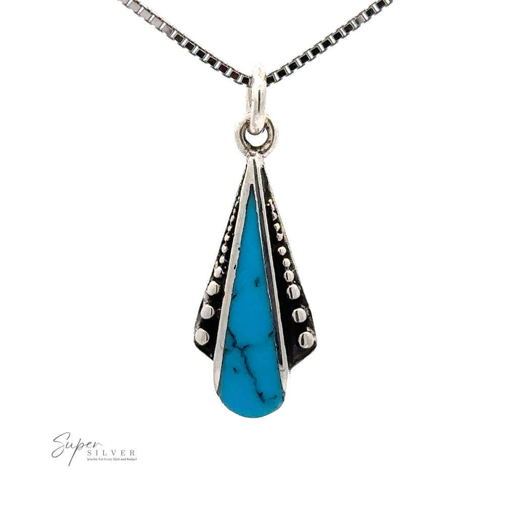 A Teardrop Pendant with Inlaid Stones and Ball Border featuring a dainty teardrop-shaped turquoise stone with dotted beaded detailing, hanging from a box chain.