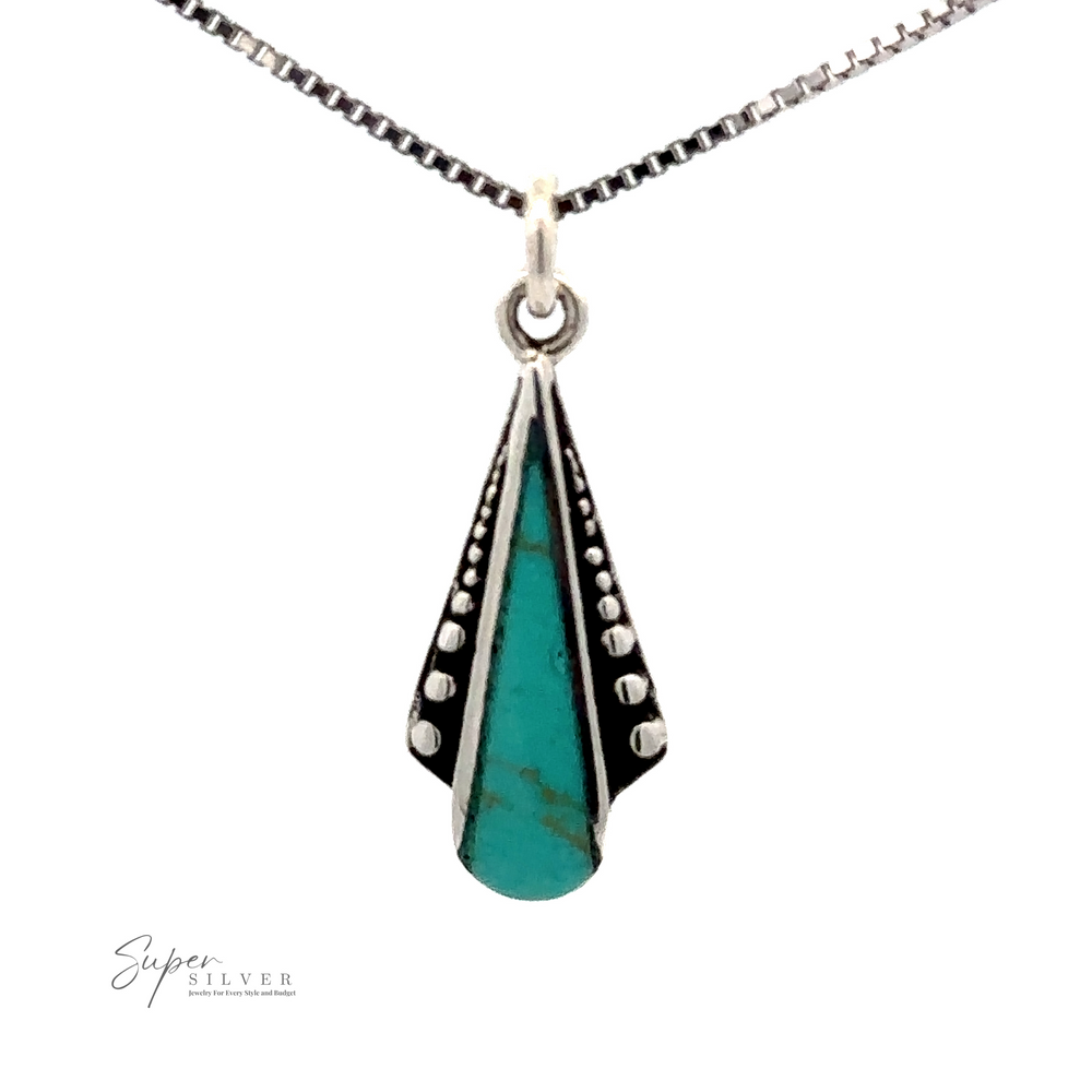 
                  
                    A sterling silver necklace with a dainty Teardrop Pendant with Inlaid Stones and Ball Border, featuring a turquoise stone and dotted silver detailing.
                  
                