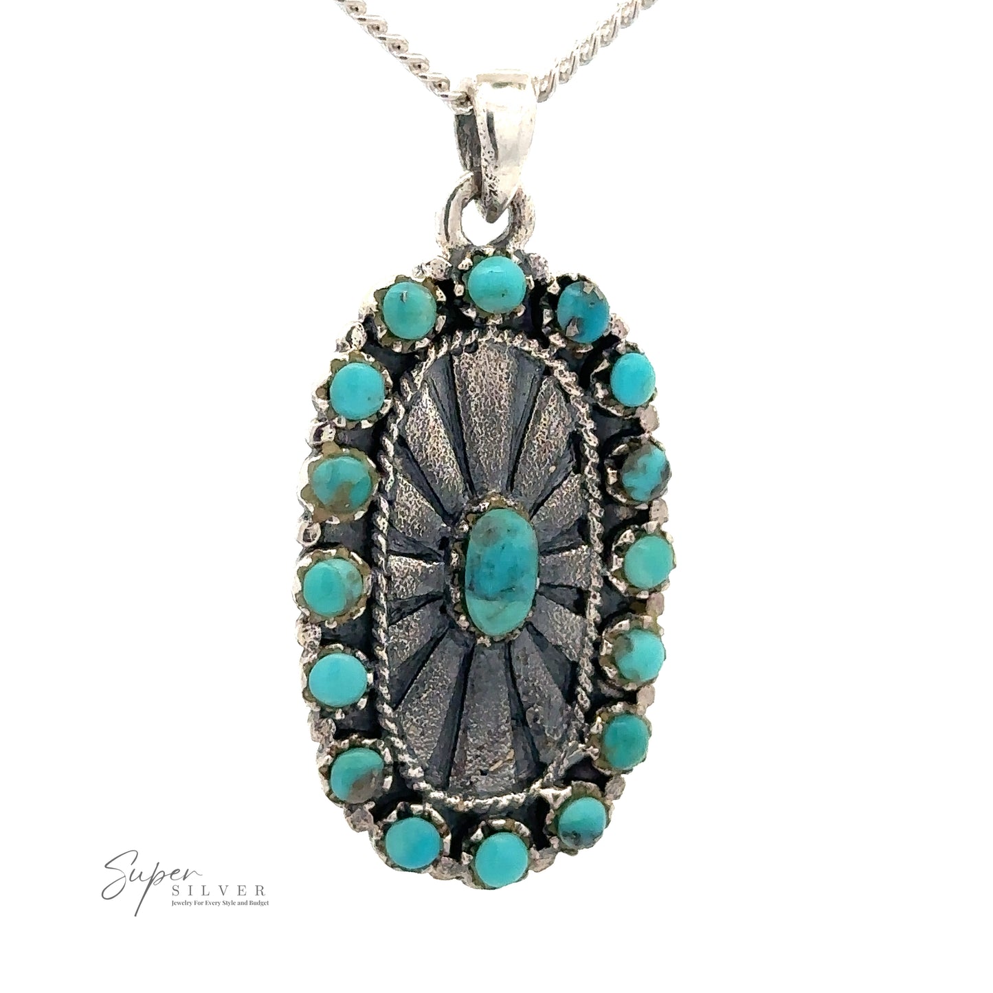 
                  
                    A Native Inspired Turquoise Pendant with turquoise stones surrounding an engraved center piece, radiating Southwestern charm, set against a white background. The "Super Silver" logo is visible in the bottom left corner.
                  
                