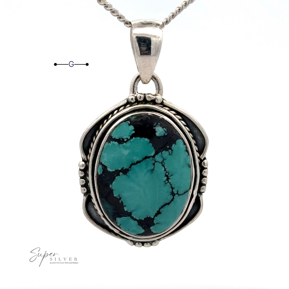 
                  
                    A Natural Turquoise Pendant with an Oval Shield Setting is shown. The stone has black veining, and the pendant hangs from a sterling silver chain. A small logo reads "Super Silver." This exquisite piece exemplifies the beauty of handmade items.
                  
                