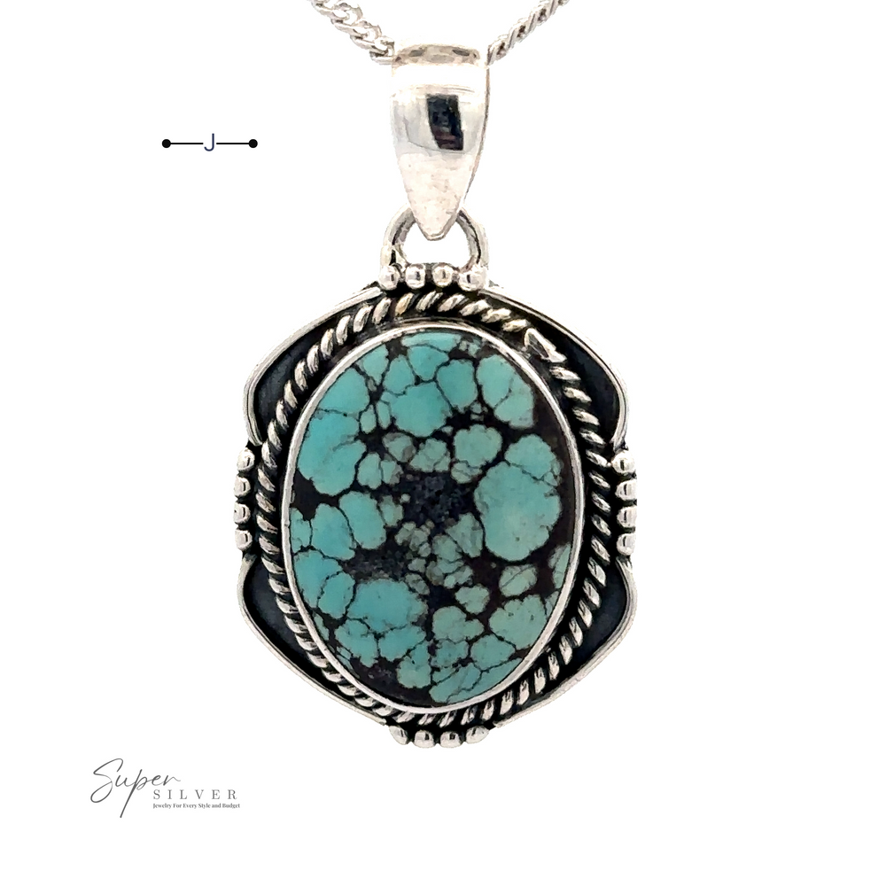 
                  
                    A Natural Turquoise Pendant with an Oval Shield Setting featuring a large natural turquoise stone with black veining, encased in an intricate sterling silver setting, hangs from a silver chain. The logo reads "Super Silver.
                  
                