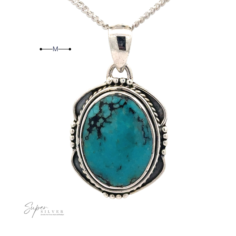 
                  
                    A Natural Turquoise Pendant with an Oval Shield Setting, featuring intricate handmade silver detailing.
                  
                