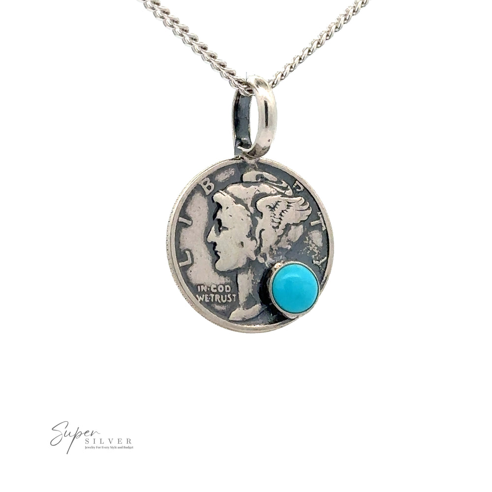 A handmade necklace featuring a Dime Pendant With A Round Turquoise, showcasing LIBERTY and IN GOD WE TRUST. The silver chain holds the Super Silver logo beneath the unique dime pendant.