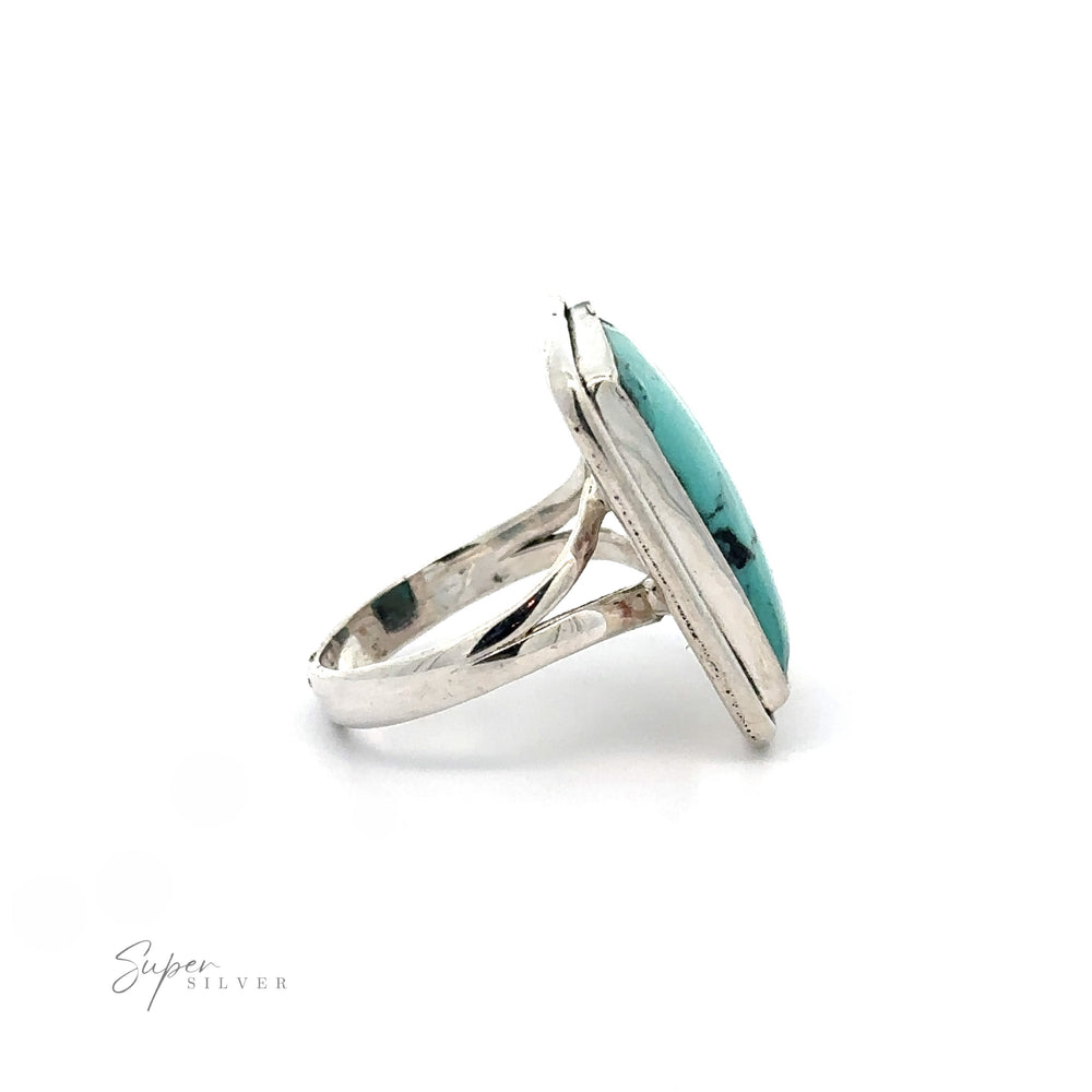 
                  
                    Rectangular Natural Turquoise Ring With Plain Border featuring a large, rectangular-shaped natural turquoise stone, set in a simple, polished band. “Super Silver” text logo in bottom left corner.
                  
                