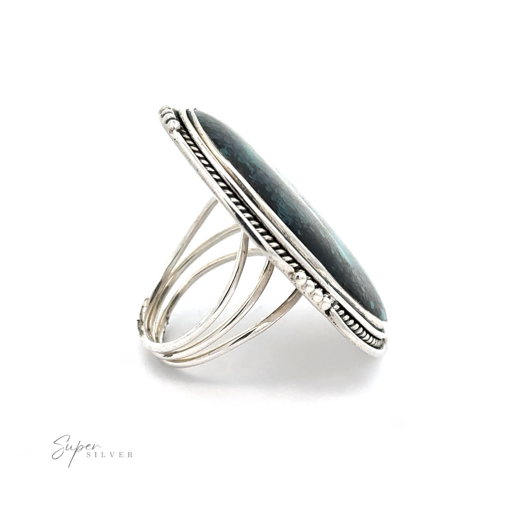 
                  
                    Oval Natural Turquoise Ring With Rope And Ball Border, displayed on a white background. This elegant design showcases a blend of craftsmanship and sophistication.
                  
                