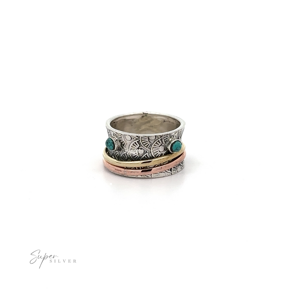 
                  
                    A Handmade Tricolor Spinner Ring with Moonstone Accents with turquoise stones.
                  
                