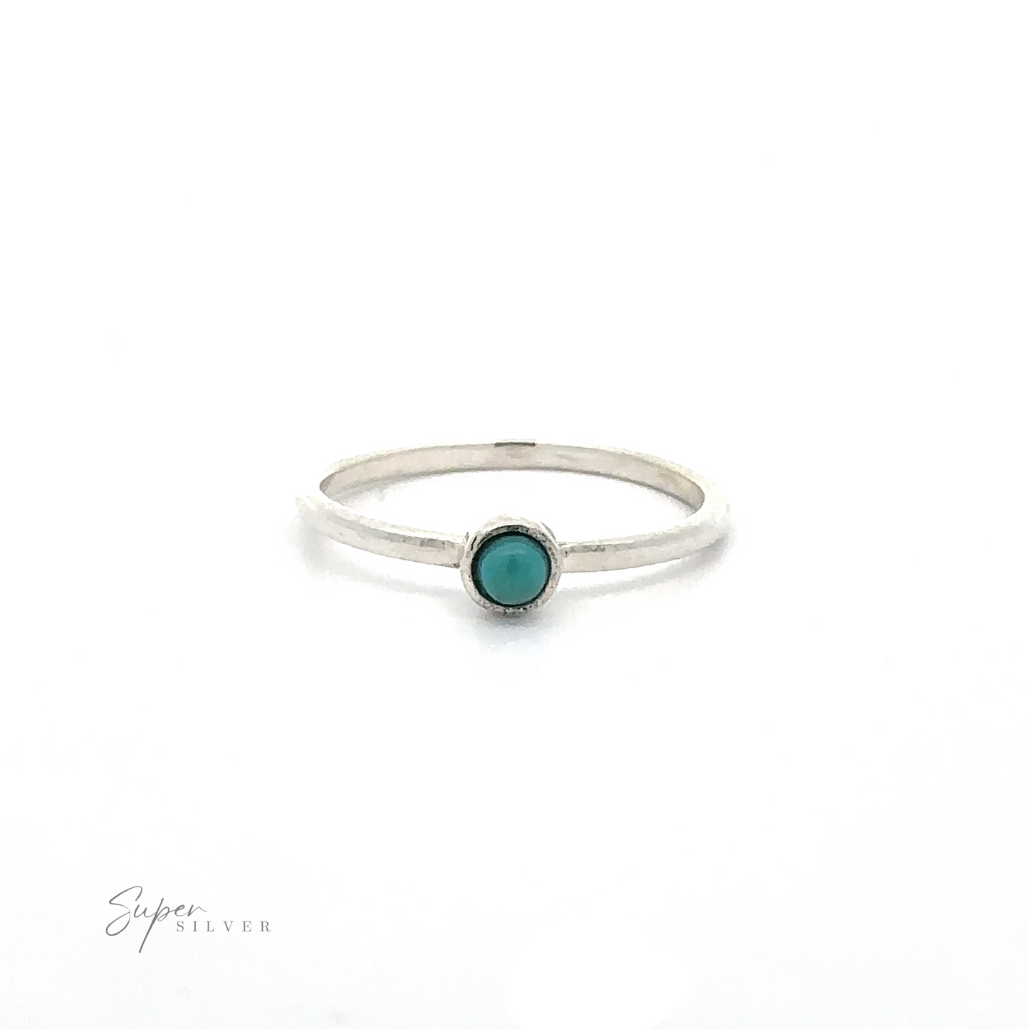 
                  
                    A simple silver ring with a small turquoise stone in the center, perfect for lovers of minimalist fashion. Displayed on a white background, the words "Dainty Stackable Round Gemstone Ring" are visible in the lower left corner. Ideal for stacking with other sterling silver or stackable rings.
                  
                
