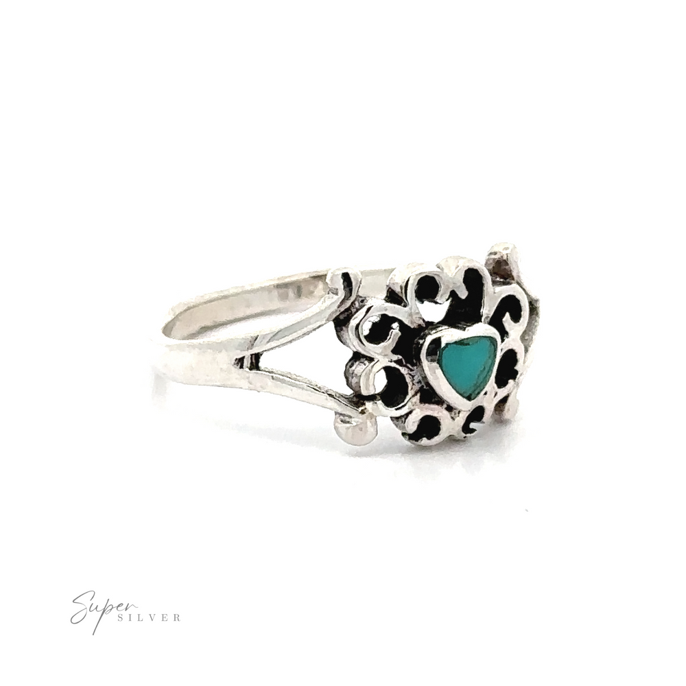 
                  
                    A sterling silver ring with a Filigree Design Surround Inlaid Stone Heart.
                  
                