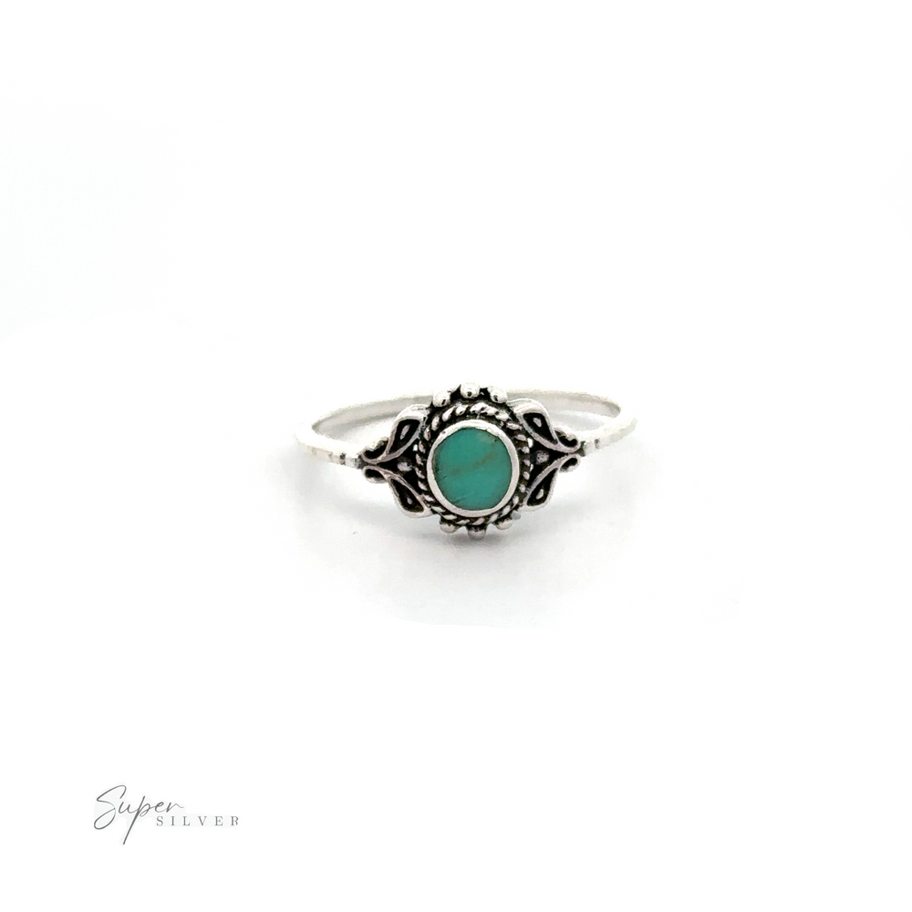 
                  
                    A Dainty Inlaid Stone Ring with Filigree with a turquoise stone in the middle.
                  
                