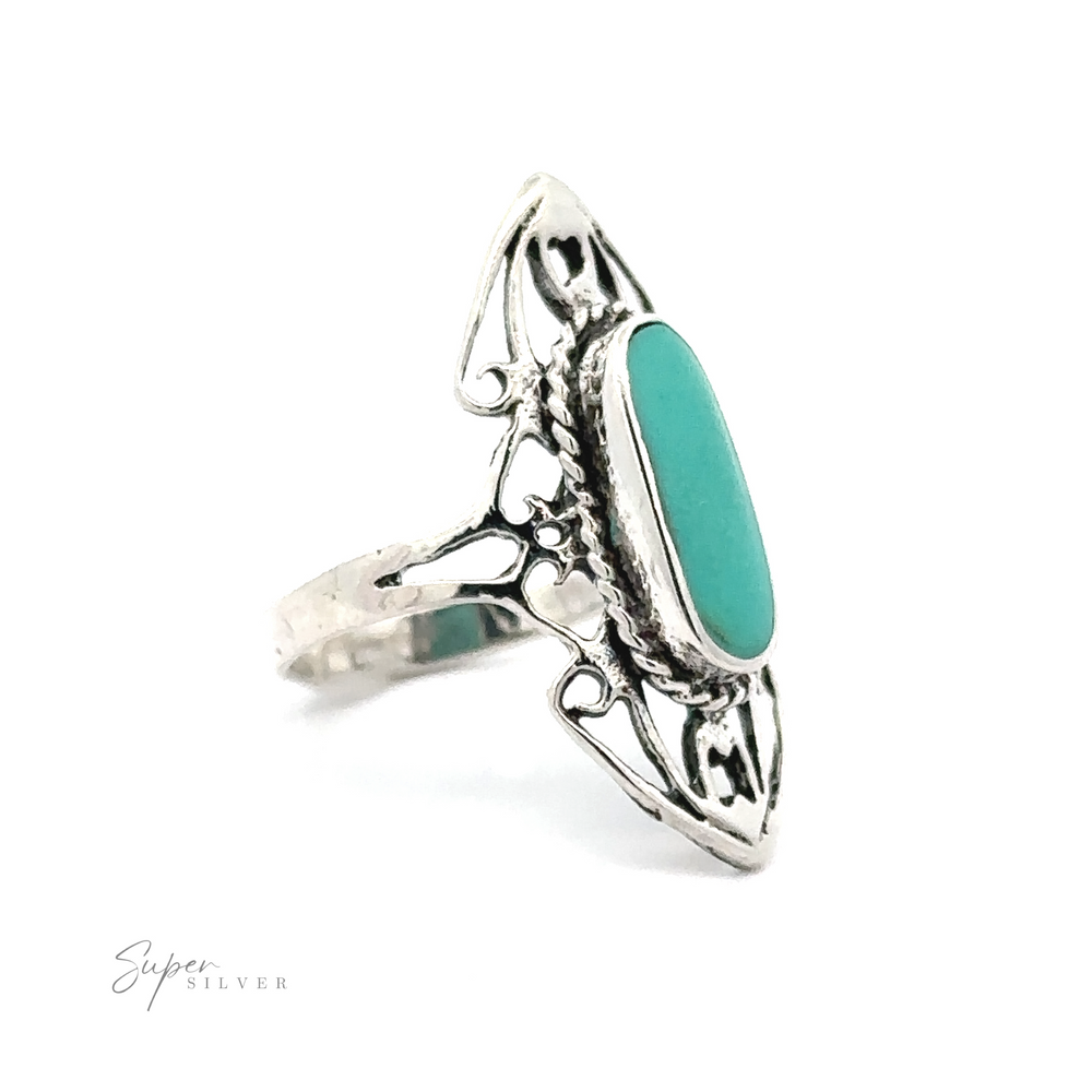 
                  
                    Elongated Filigree Ring With Oval Inlaid Stone with an oval turquoise stone set in an open filigree band.
                  
                