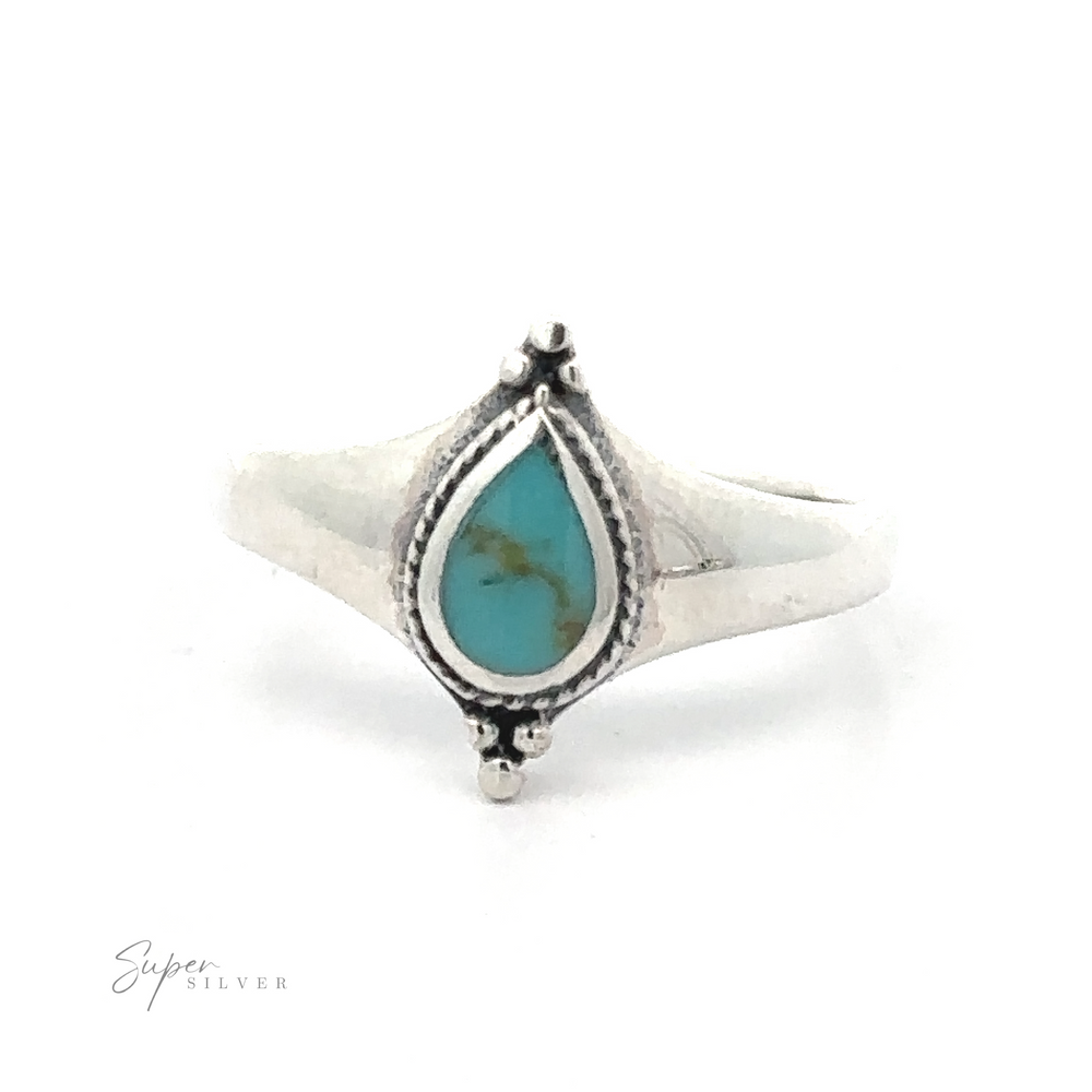 
                  
                    A sterling silver ring with a Teardrop Inlay Shield Ring set in a decorative mount.
                  
                