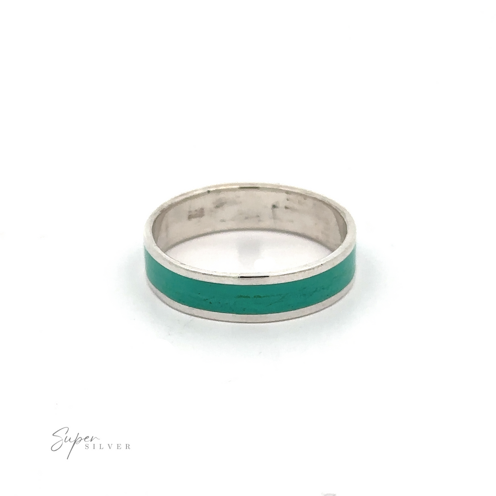 
                  
                    A Sophisticated Inlay Band thumb ring made of .925 Sterling Silver, adorned with green enamel.
                  
                