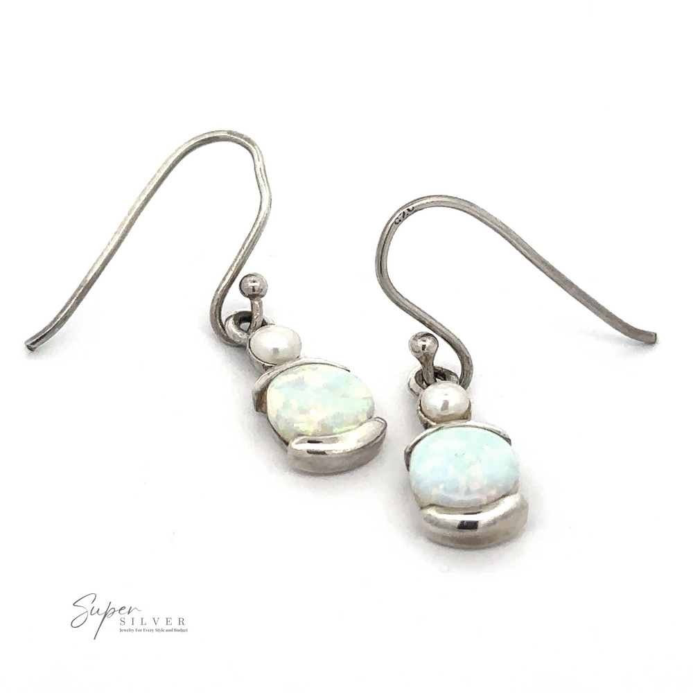 A pair of White Created Opal Oblong Earrings featuring lab-created opal gemstones and small silver beads, both connected by curved hooks. The logo "Super Silver" is visible in the bottom left corner of the image.